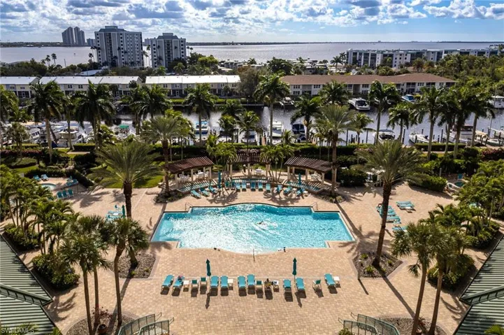 Community pool with a water view