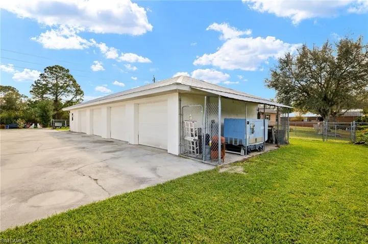 Garage with a gate and fence