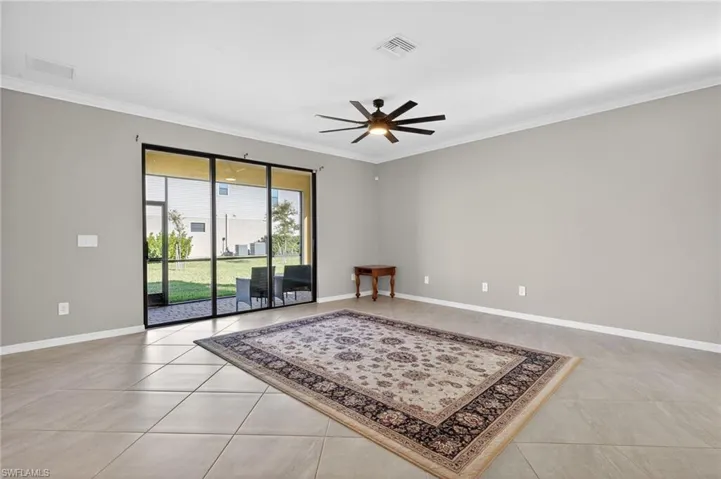 Unfurnished room with ornamental molding and a ceiling fan