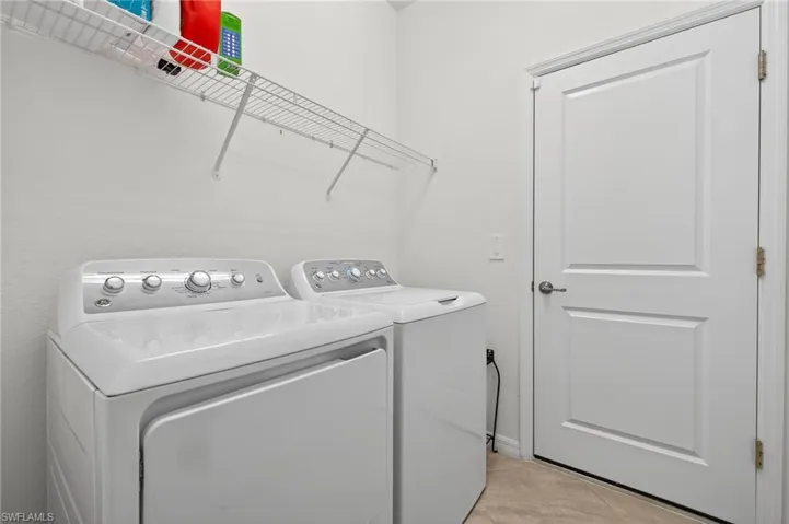 Laundry room featuring separate washer and dryer