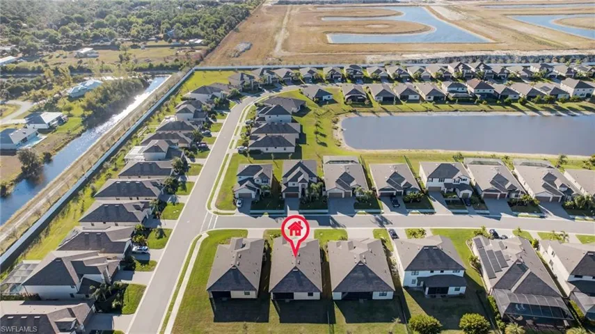 Aerial view of residential area with a large body of water