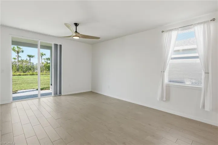Bright interior space featuring light-toned wood-finish flooring