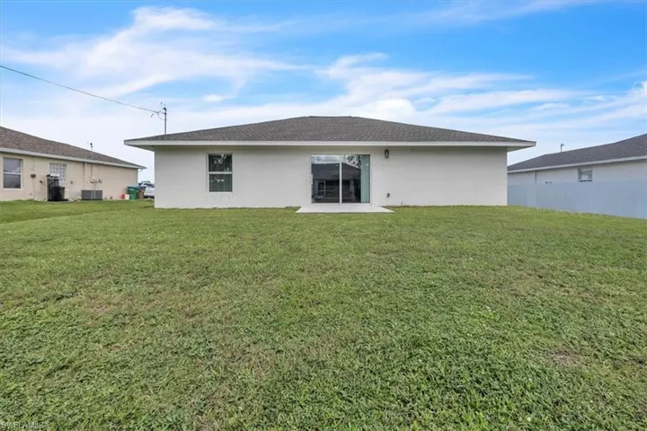 Back of property featuring stucco siding