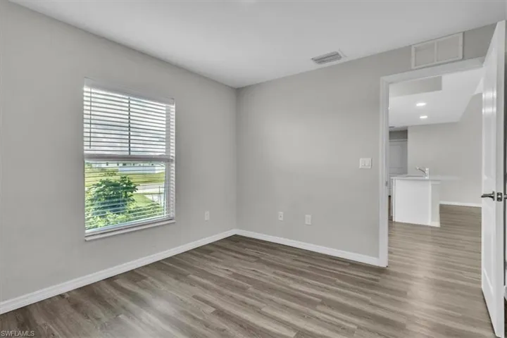 Unfurnished room with wood finished floors