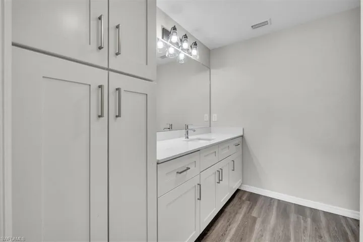 Bathroom with vanity and light wood-type flooring