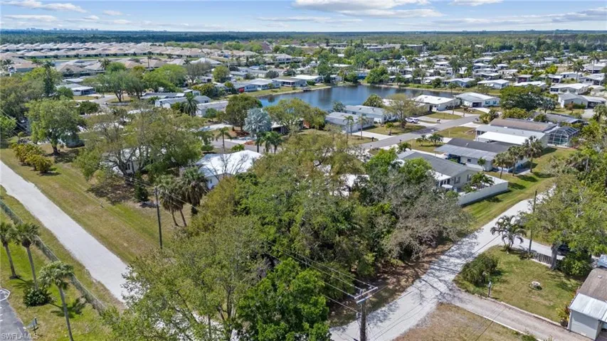 Birds eye view of property featuring a residential view and a water view