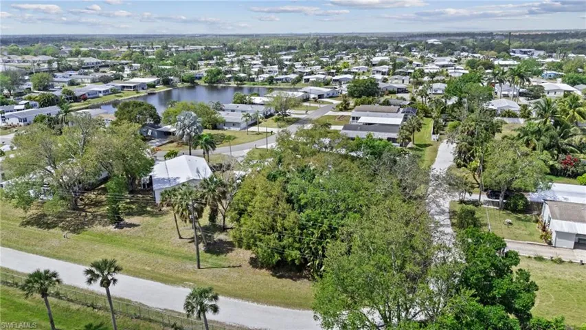 Aerial view featuring a residential view and a water view