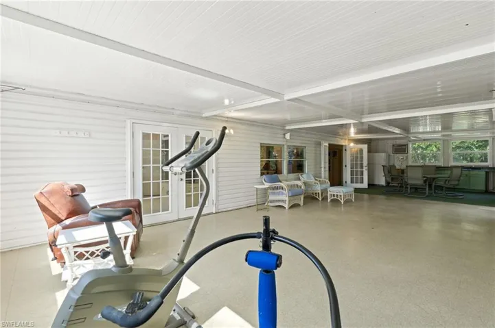 Exercise room featuring french doors