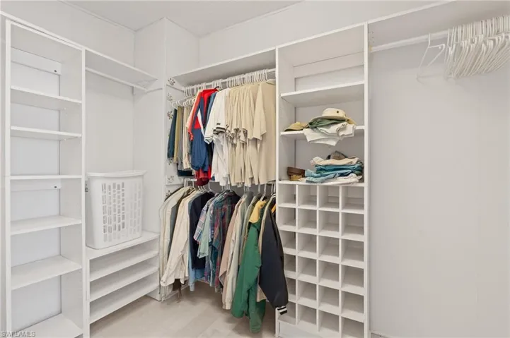 Spacious closet featuring wood finished floors