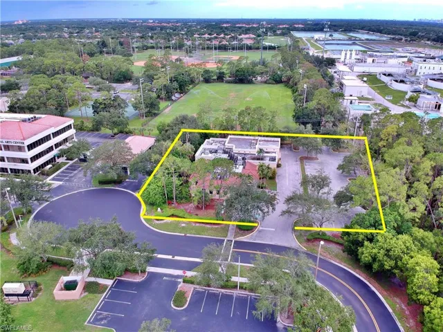 Aerial view of property and surrounding area featuring property parcel outlined
