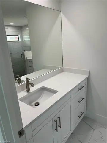 Bathroom with vanity and tile patterned floors