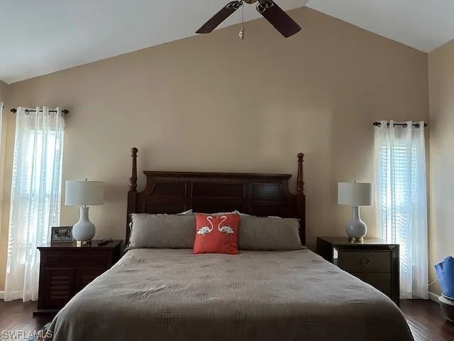 Bedroom with dark wood-style floors and a ceiling fan