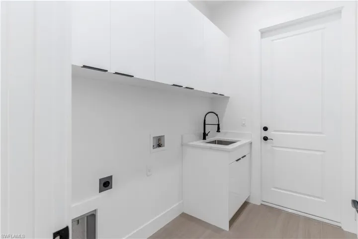 Laundry room with cabinet space, and washer and dryer hookup