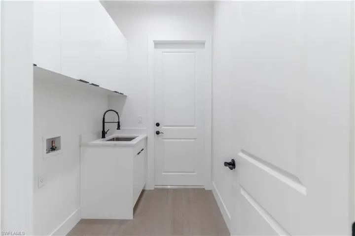 Laundry room with cabinet space, and washer and dryer hookup