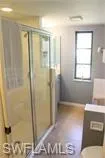 Full bath with vanity and a stall shower