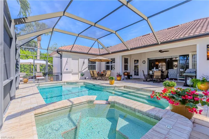 View of pool featuring a patio, outdoor dining space, a lanai, and a ceiling fan