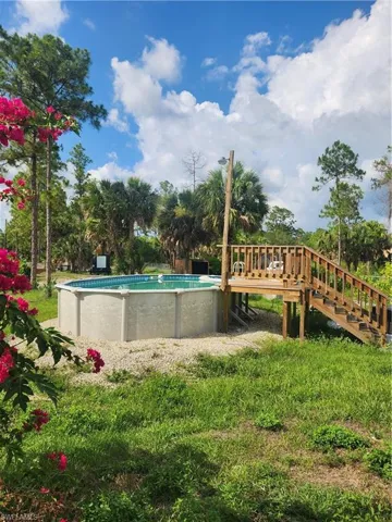 View of pool featuring a deck