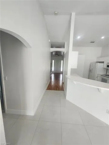Corridor featuring light wood-type flooring