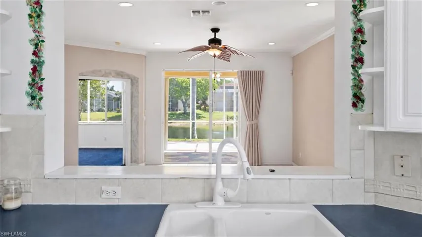 Kitchen sink with a white faucet and dual basins