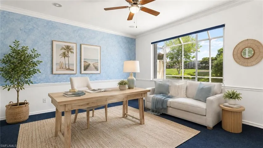 Spacious interior room featuring a large screened window, deep blue carpeting, and a ceiling fan with integrated lighting