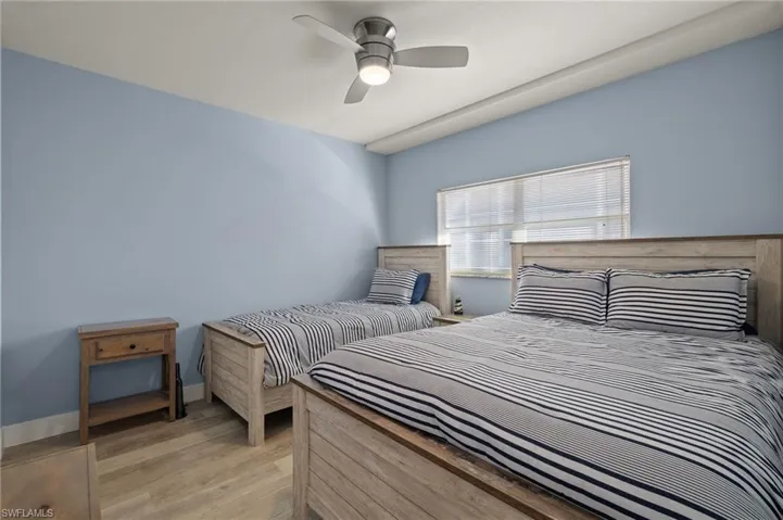 Bedroom featuring light wood-style floors and a ceiling fan