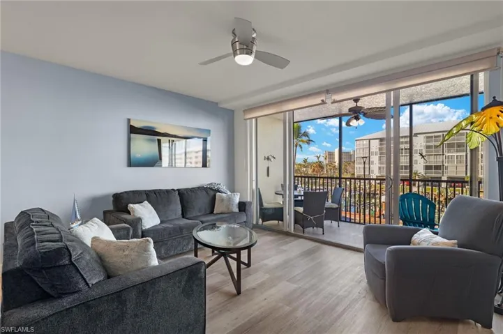 Living room featuring wood finished floors and ceiling fan
