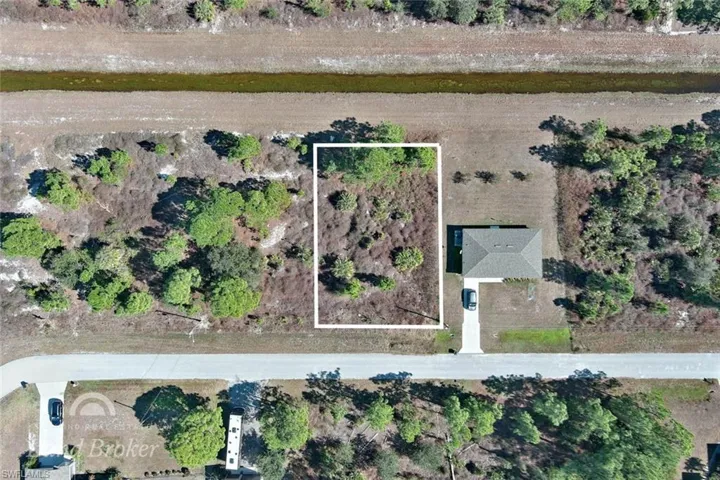 Aerial overview of property's location with property parcel outlined