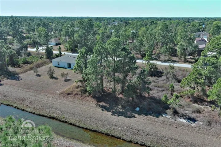Aerial overview of property's location featuring a large body of water