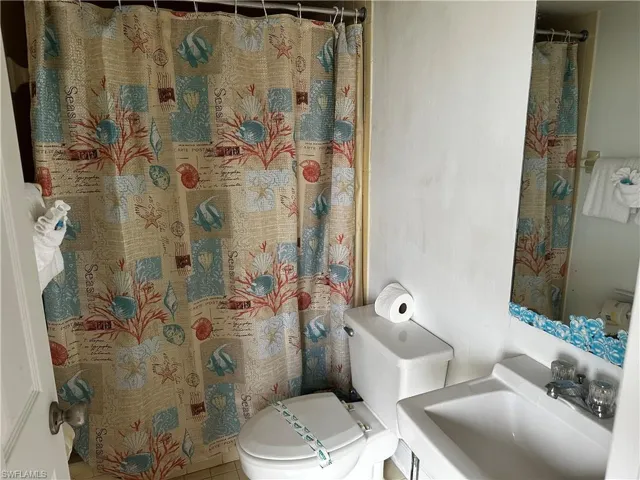 Bathroom featuring sink and toilet