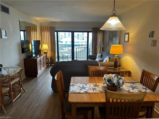 Dining space featuring dark hardwood / wood-style flooring