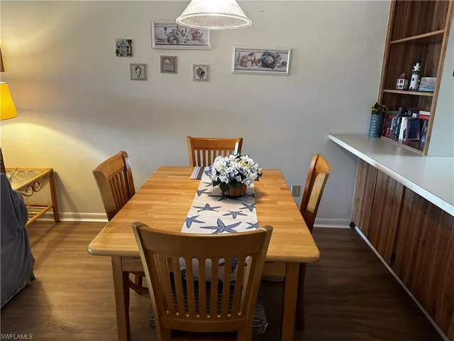 Dining area featuring dark hardwood / wood-style flooring
