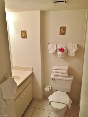 Bathroom featuring vanity, toilet, and tile patterned floors