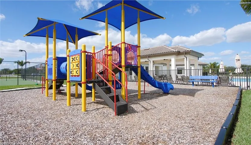 View of play area with a community pool