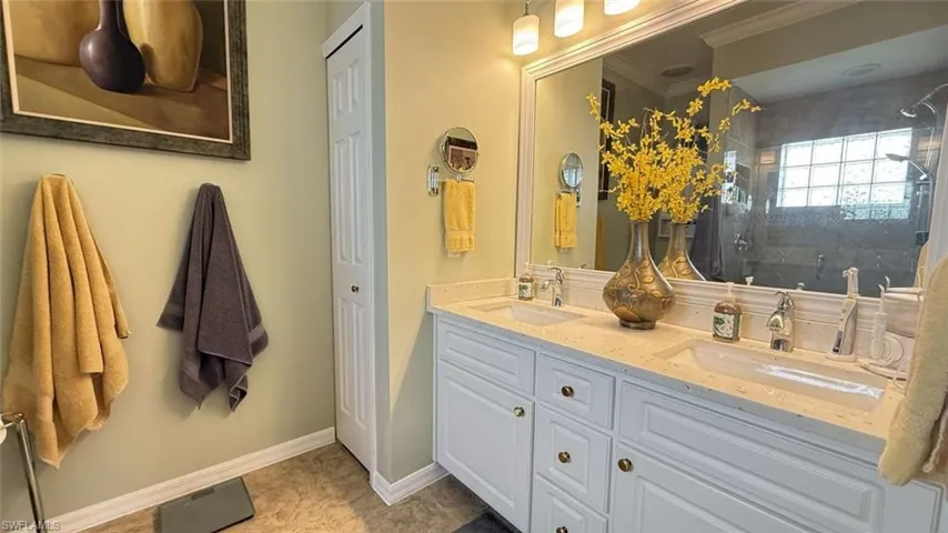 Bathroom with a shower stall and double vanity