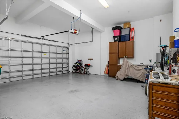 Oversized two Car Garage with a garage door opener.