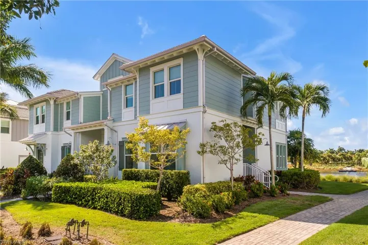 View of front of house featuring tropical Landscaping.