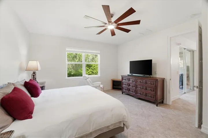 Bedroom featuring ceiling fan and light tile patterned floors
