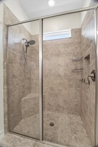 Full bath featuring a stall shower