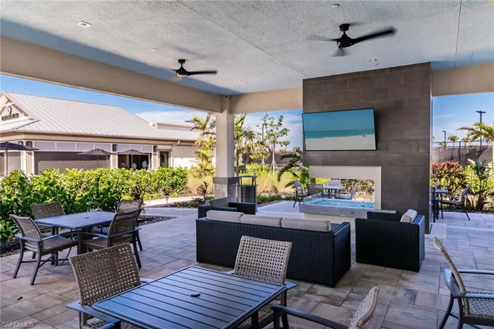 View of patio / terrace with an outdoor hangout area, a ceiling fan, and outdoor dining space