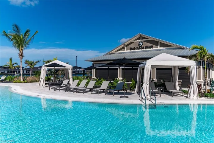 Community pool with a patio area and a gazebo