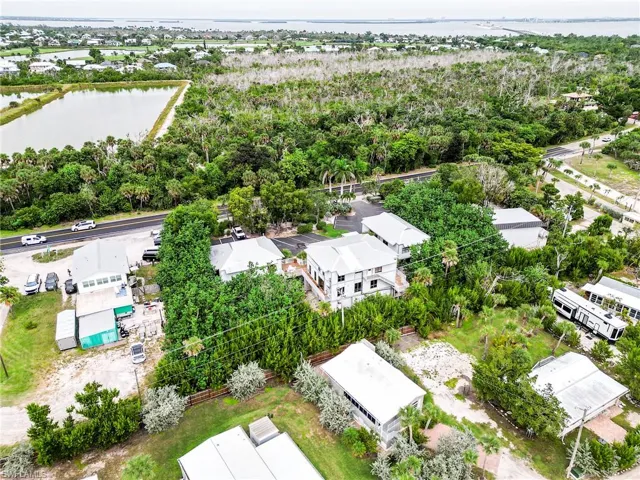 Aerial view of residential area featuring a large body of water