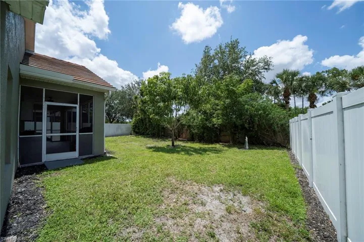 View of yard with a sunroom