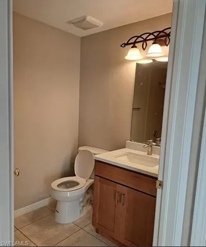 Bathroom featuring vanity and light tile patterned floors