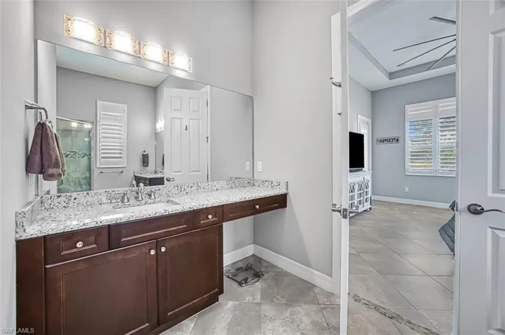 Bathroom featuring vanity and tile patterned floors