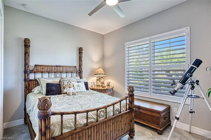 Bedroom featuring ceiling fan and light tile patterned flooring