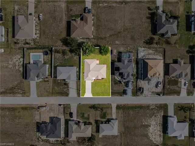Birds eye view of property with a residential view