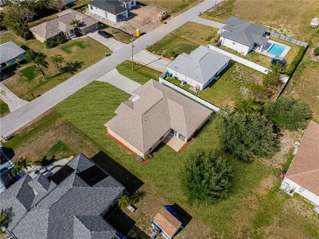 Birds eye view of property with a residential view