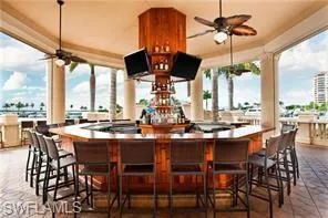 View of patio / terrace with exterior bar and ceiling fan