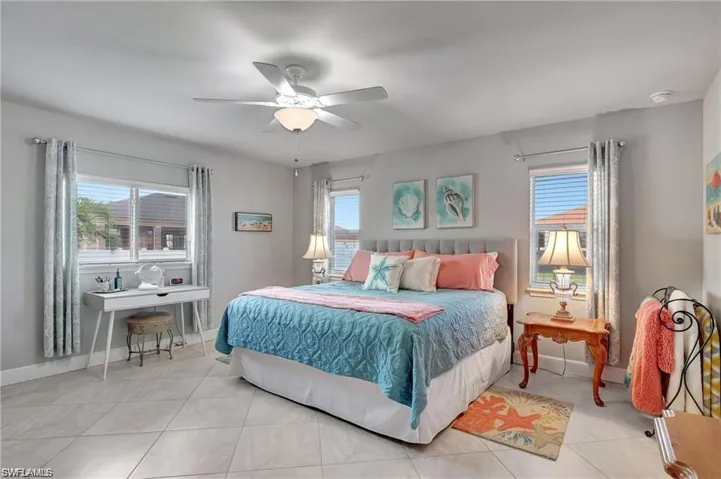 Tiled bedroom with ceiling fan