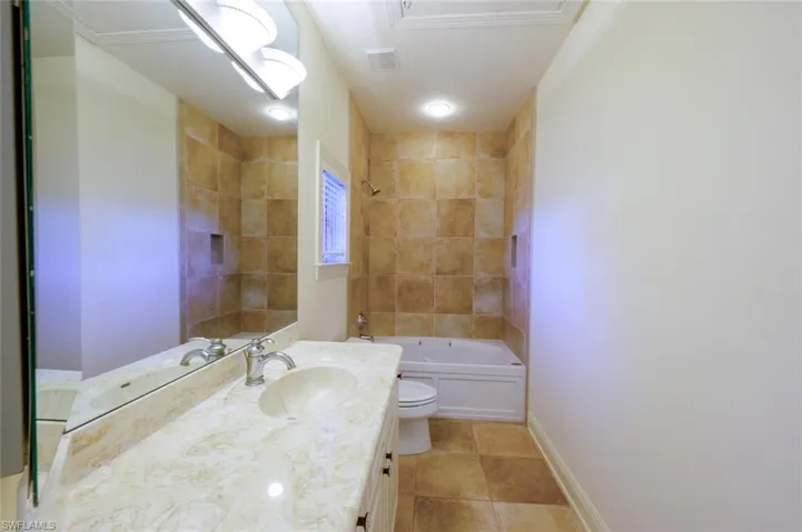 Built in Kitchen with Gas Grill, tile counter top and Counter Seating